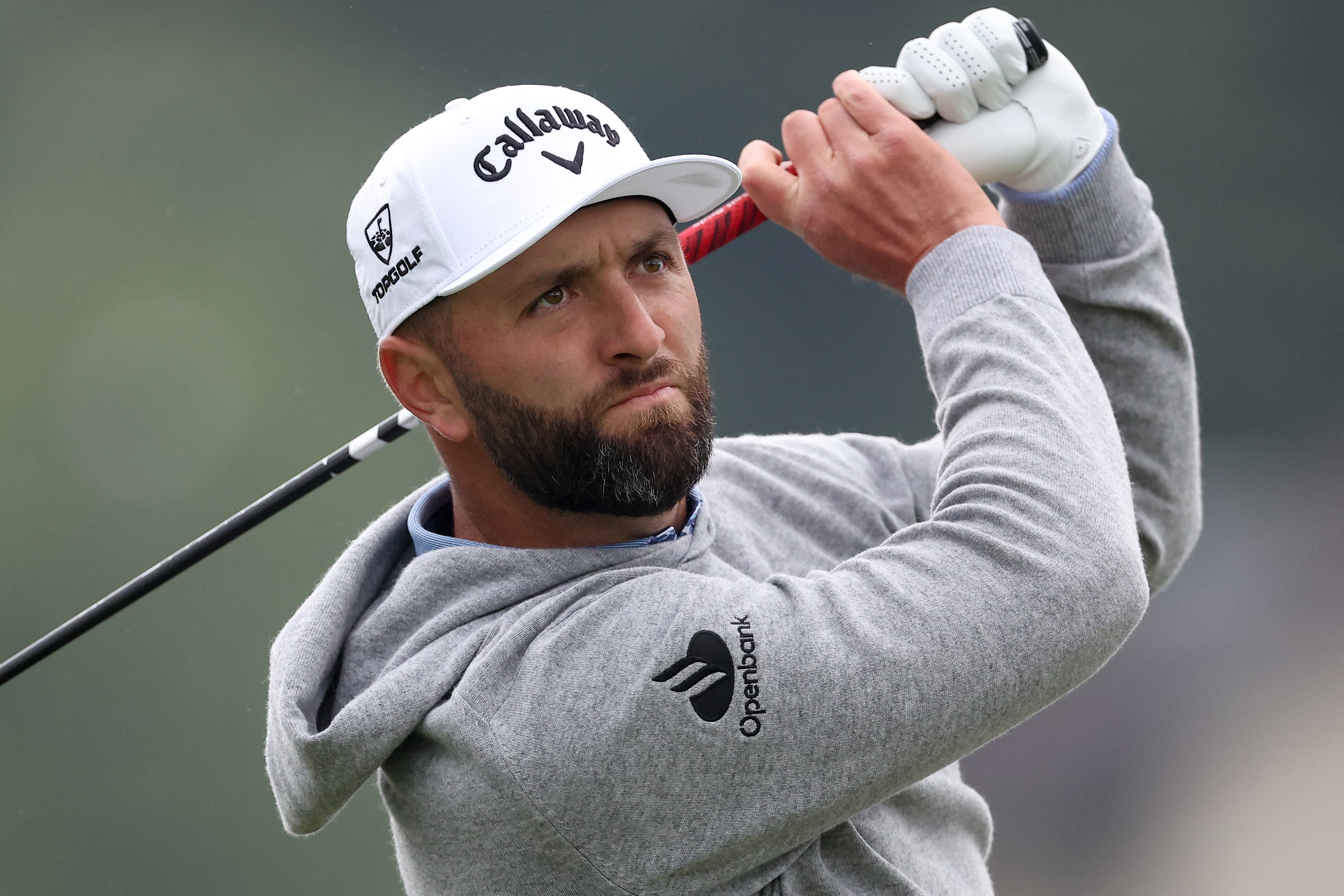 May 14, 2026; Newtown Square, Pennsylvania, USA; Jon Rahm plays his shot from the 11th tee during the first round of the PGA Championship golf tournament at Aronimink Golf Club. Mandatory Credit: Bill Streicher-Imagn Images