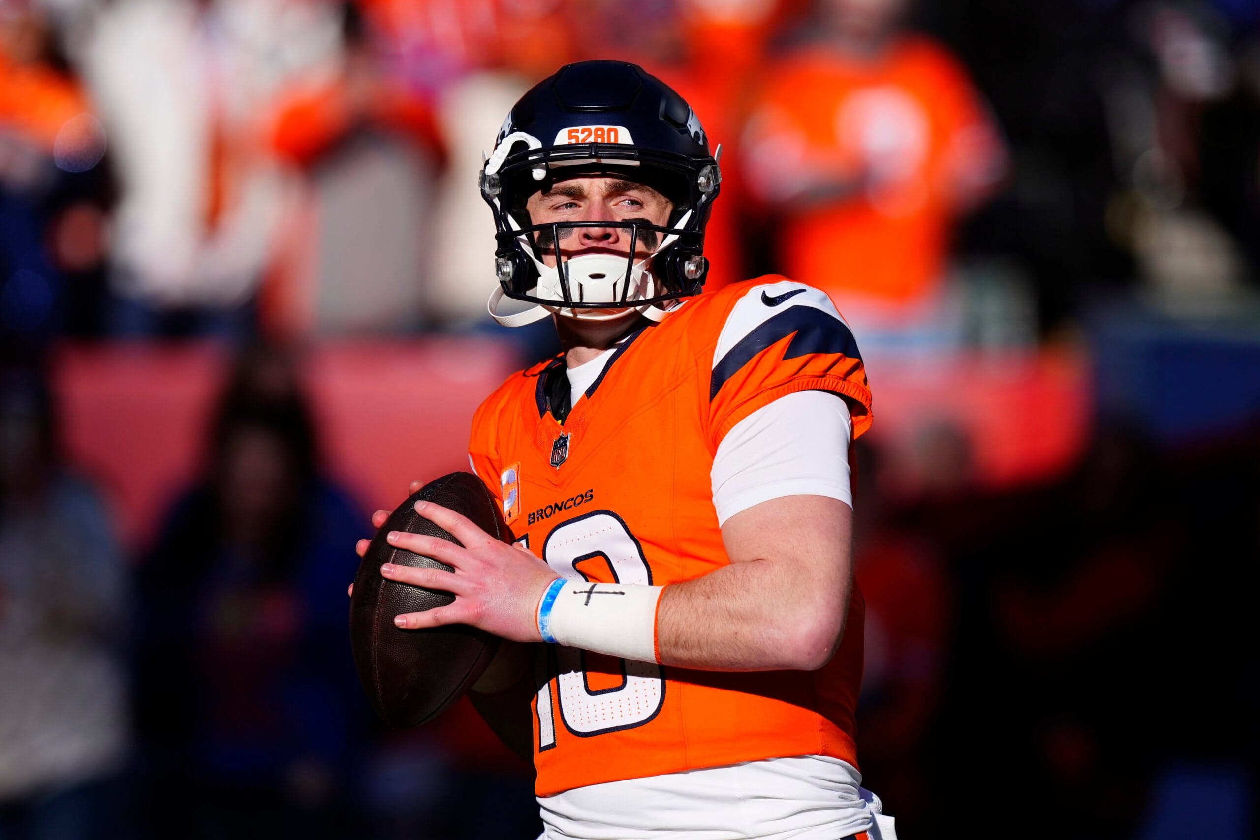Jan 17, 2026; Denver, CO, USA; Denver Broncos quarterback Bo Nix (10) warms up before an AFC Divisional Round playoff game against the Buffalo Bills at Empower Field at Mile High.