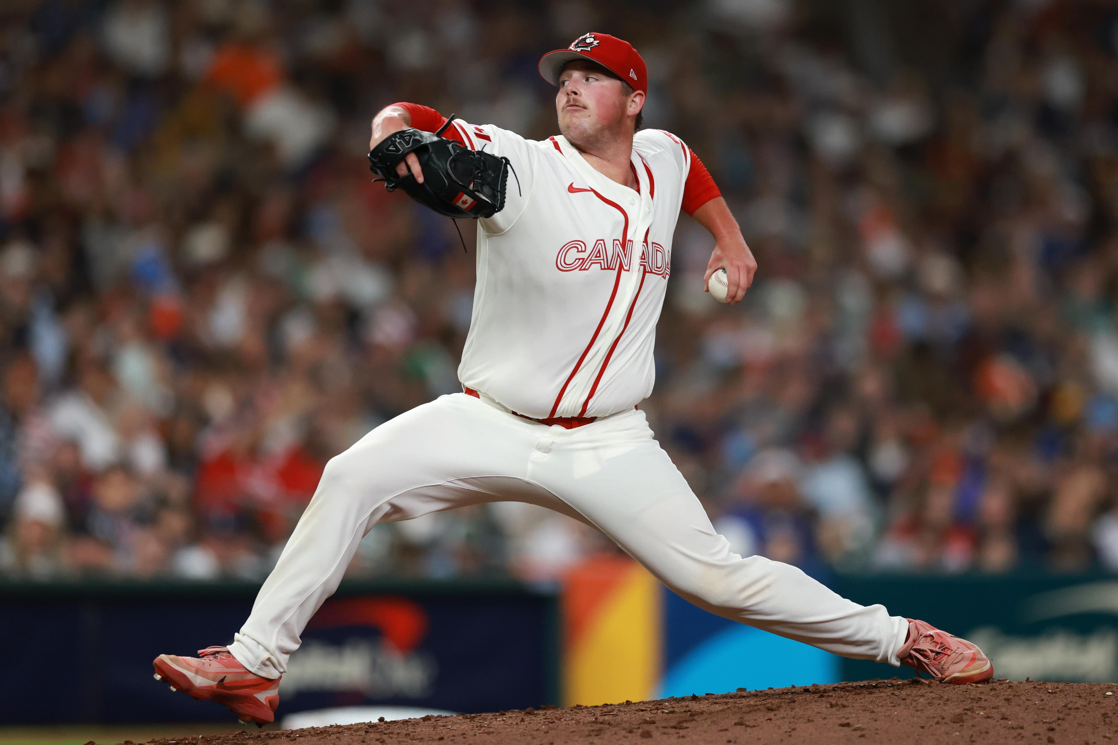 Matt Wilkinson throwing a pitch. 