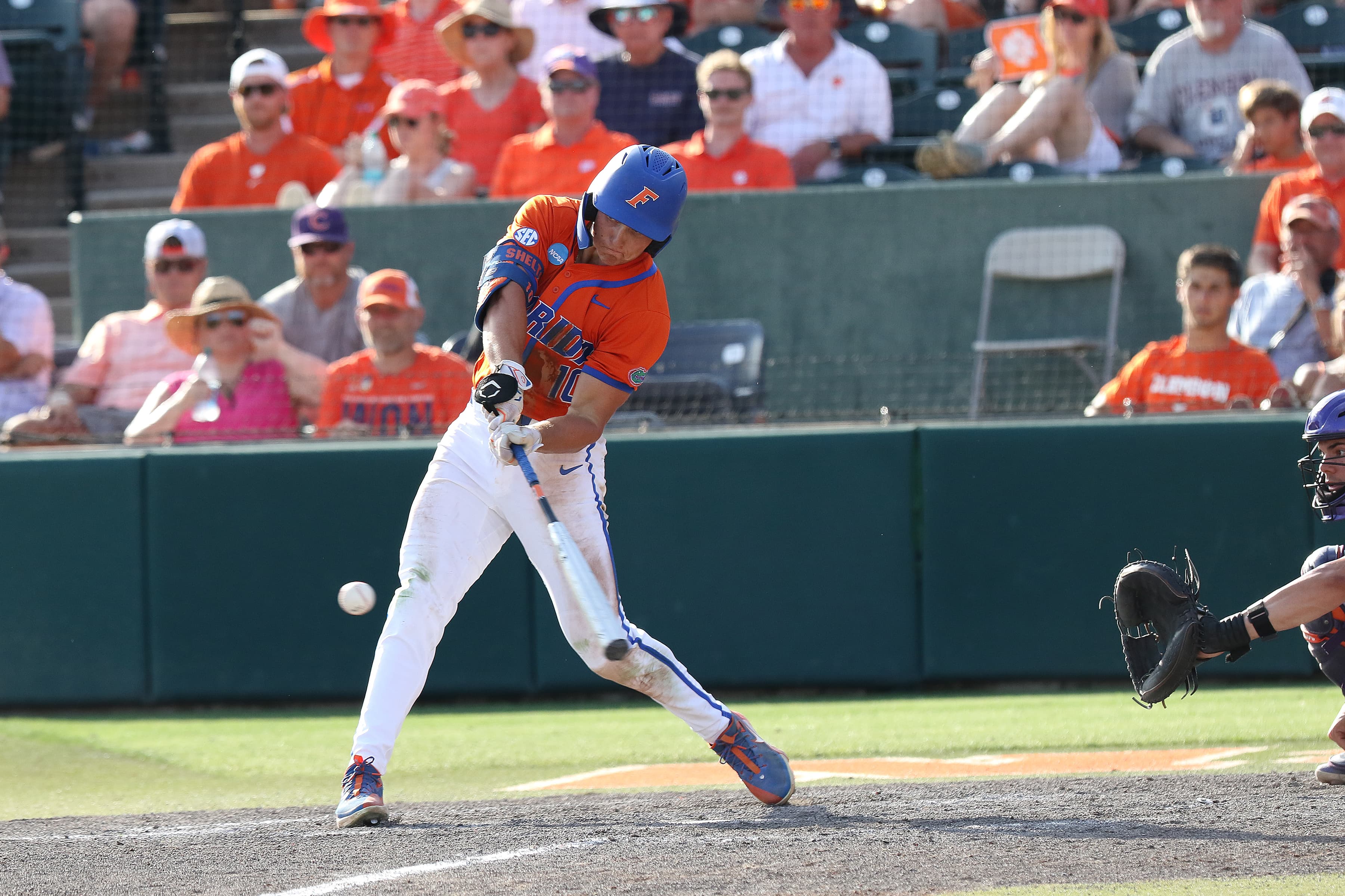 Colby Shelton taking a left-handed swing, about to make contact with the ball, at University of Florida.