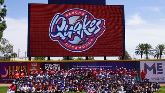 Rancho Cucamonga Quakes players take photo with youth clinic participants