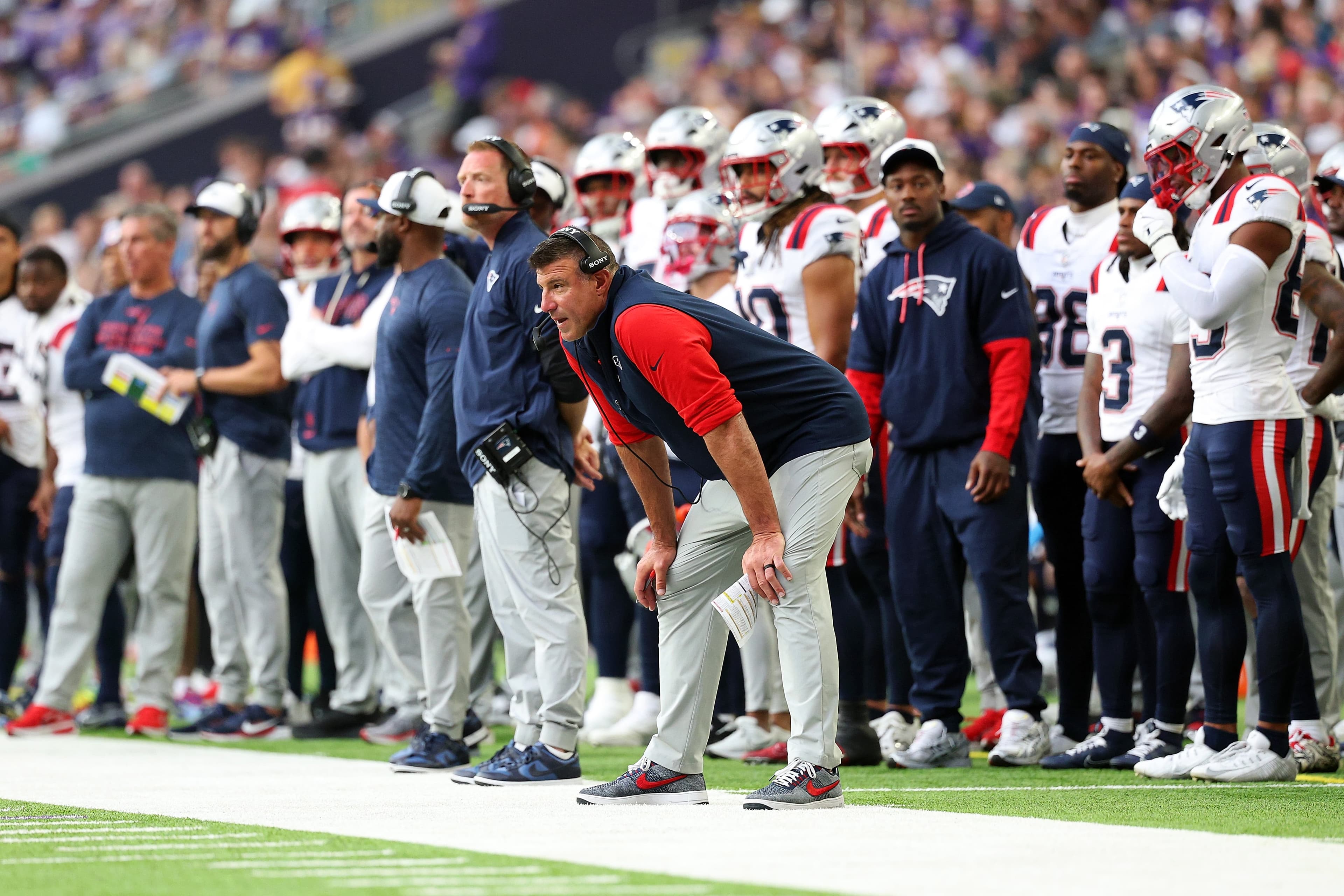 MINNEAPOLIS, MINNESOTA - AUGUST 16: Head coach Mike Vrabel of the New England Patriots looks on against the Minnesota Vikings in the second quarter during the NFL Preseason 2025 game between New England Patriots and Minnesota Vikings at U.S. Bank Stadium on August 16, 2025 in Minneapolis, Minnesota. The Patriots defeated the Vikings 20-12. (Photo by David Berding/Getty Images)