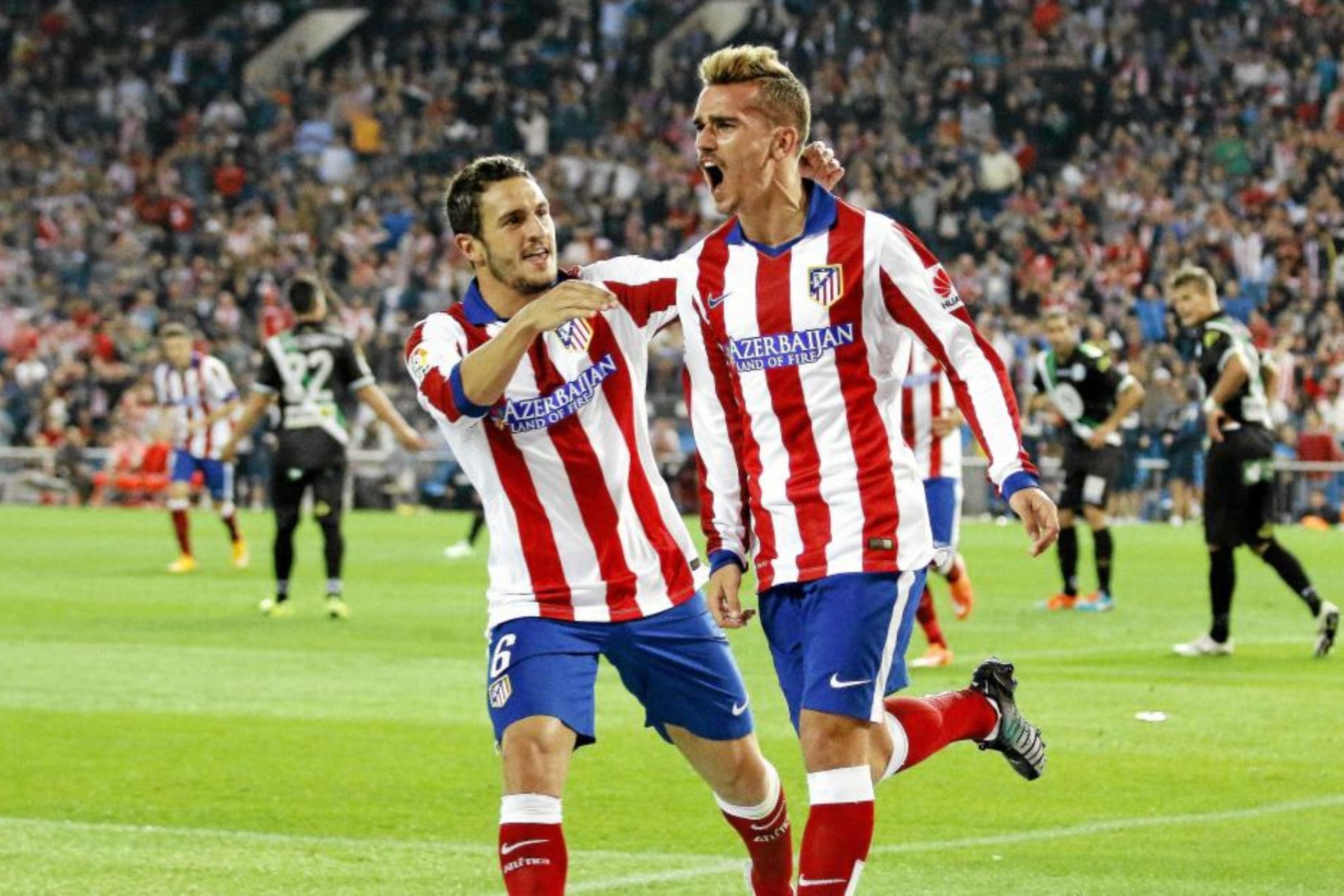 Koke y Griezmann celebran un gol en sus primeros años en el Atlético.