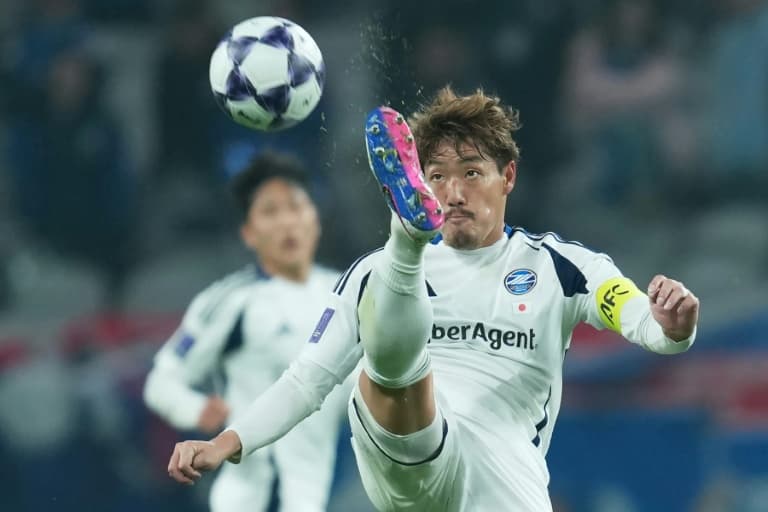 Japanese team with school coach to cap remarkable journey to the top