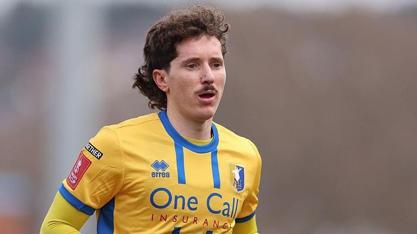 Midfielder Lewis among three leaving Mansfield