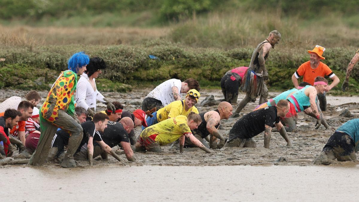 Plucky competitors prepare to take on mud race