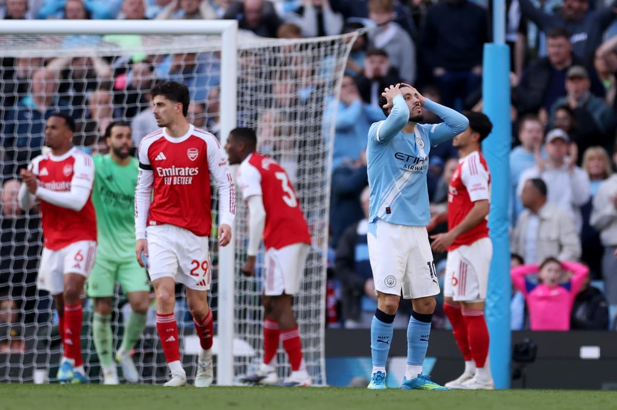 Arsenal suffer title blow as Manchester City edge thrilling Etihad clash