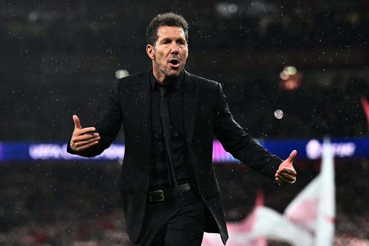 Arsenal fans heckle Diego Simeone after stepping on badge following Champions League defeat
