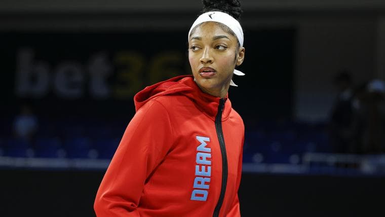 Angel Reese stuns in houndstooth matching jacket and mini skirt for Atlanta Dream debut