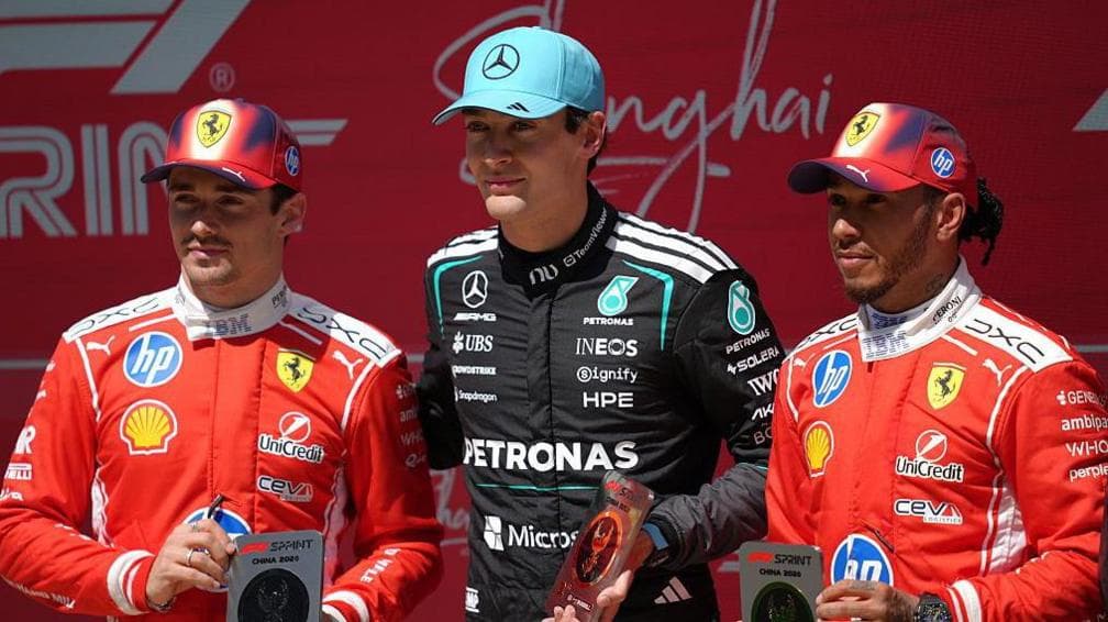 Charles Leclerc, George Russell and Lewis Hamilton hold up medals after the China sprint race in March
