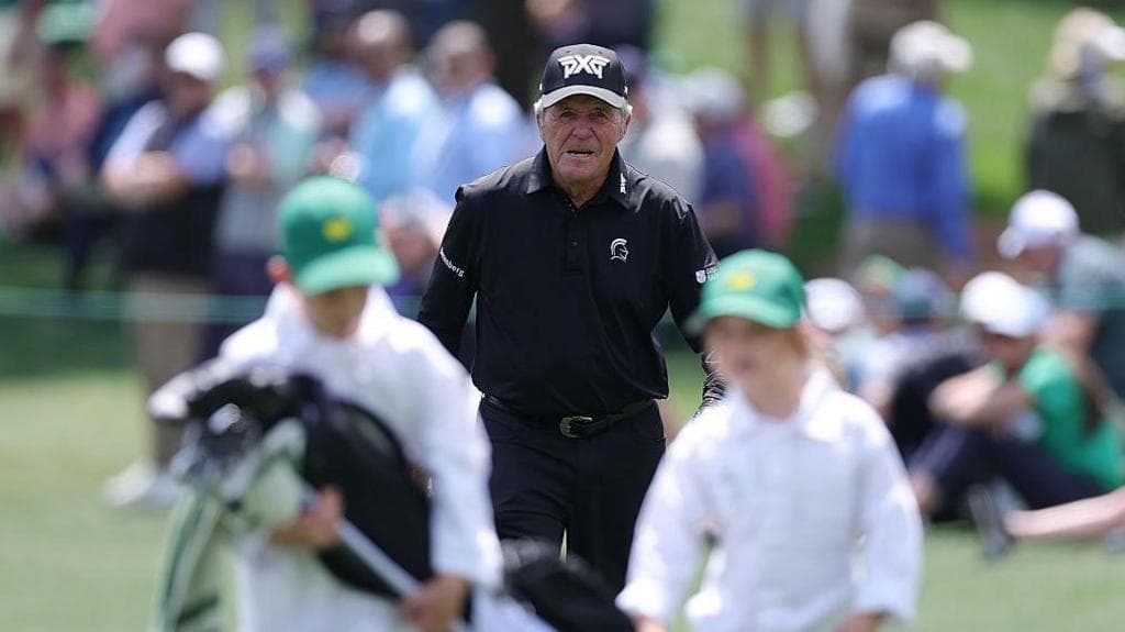 Gary Player walking down a fairway during the Masters' Par 3 contest