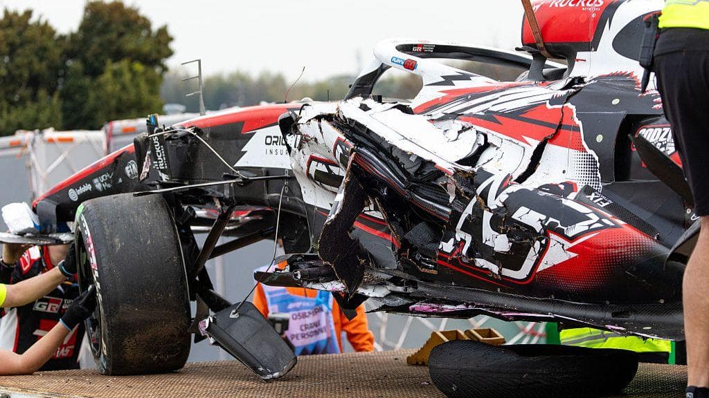 Oliver Bearman's damaged Haas is lifted on to a recovery truck at the Japanese Grand Prix