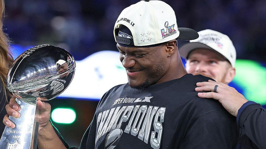 Kenneth Walker holding the Super Bowl trophy after winning with the Philadelphia Eagles