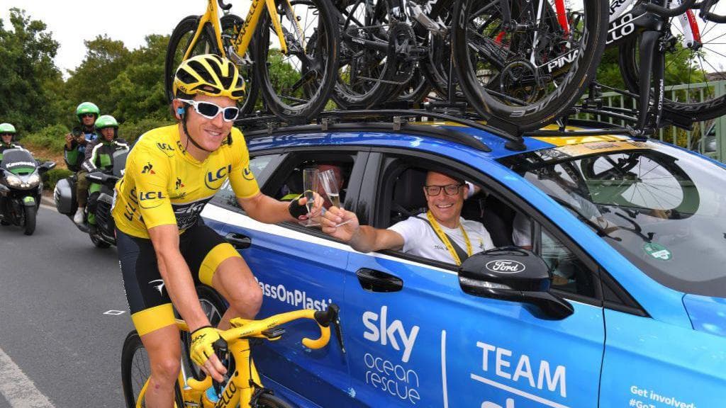 Geraint Thomas and Dave Brailsford celebrate winning the 2018 Tour de France