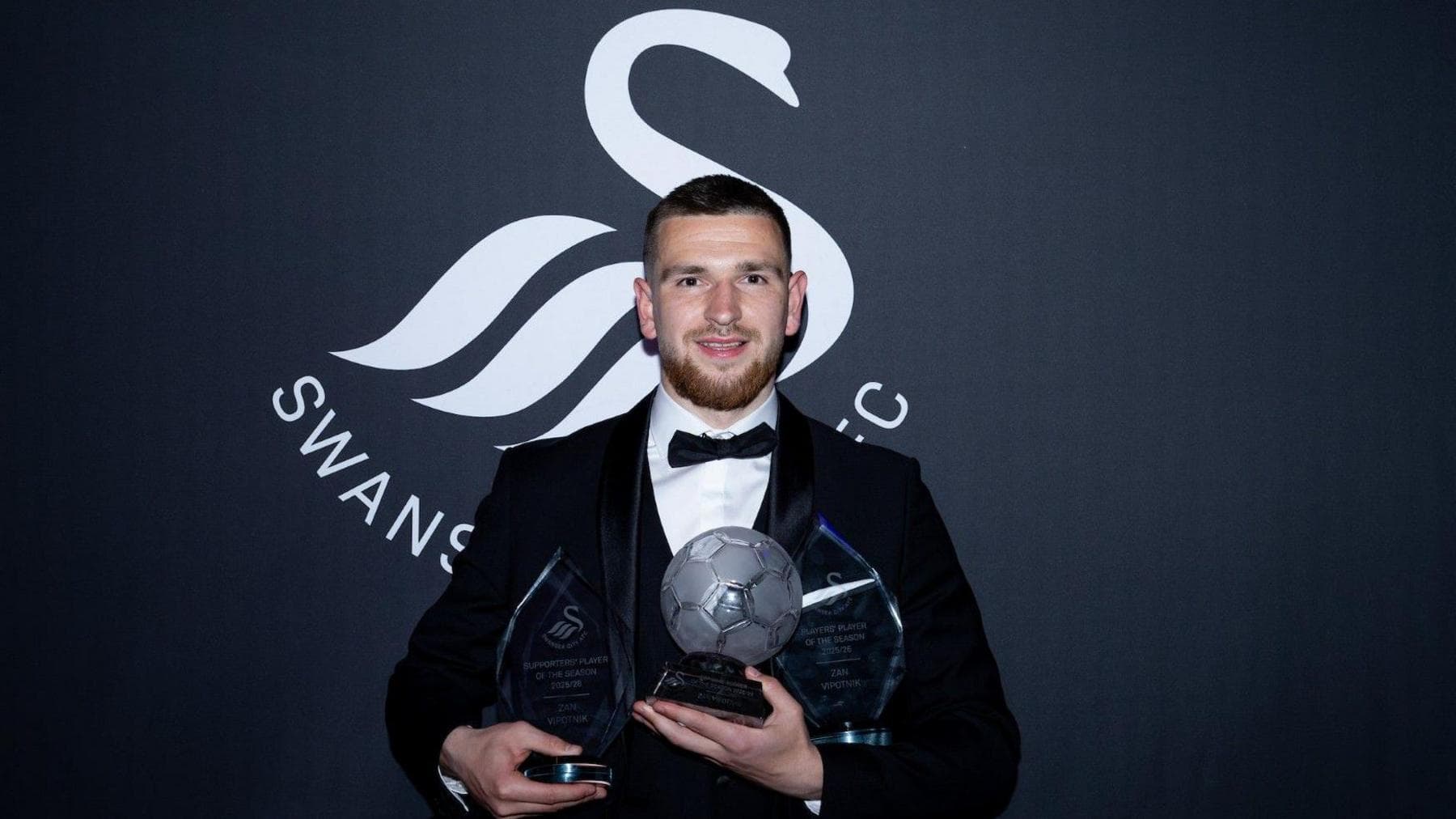 Zan Vipotnik with his three trophies at the Swansea City end-of-season awards dinner