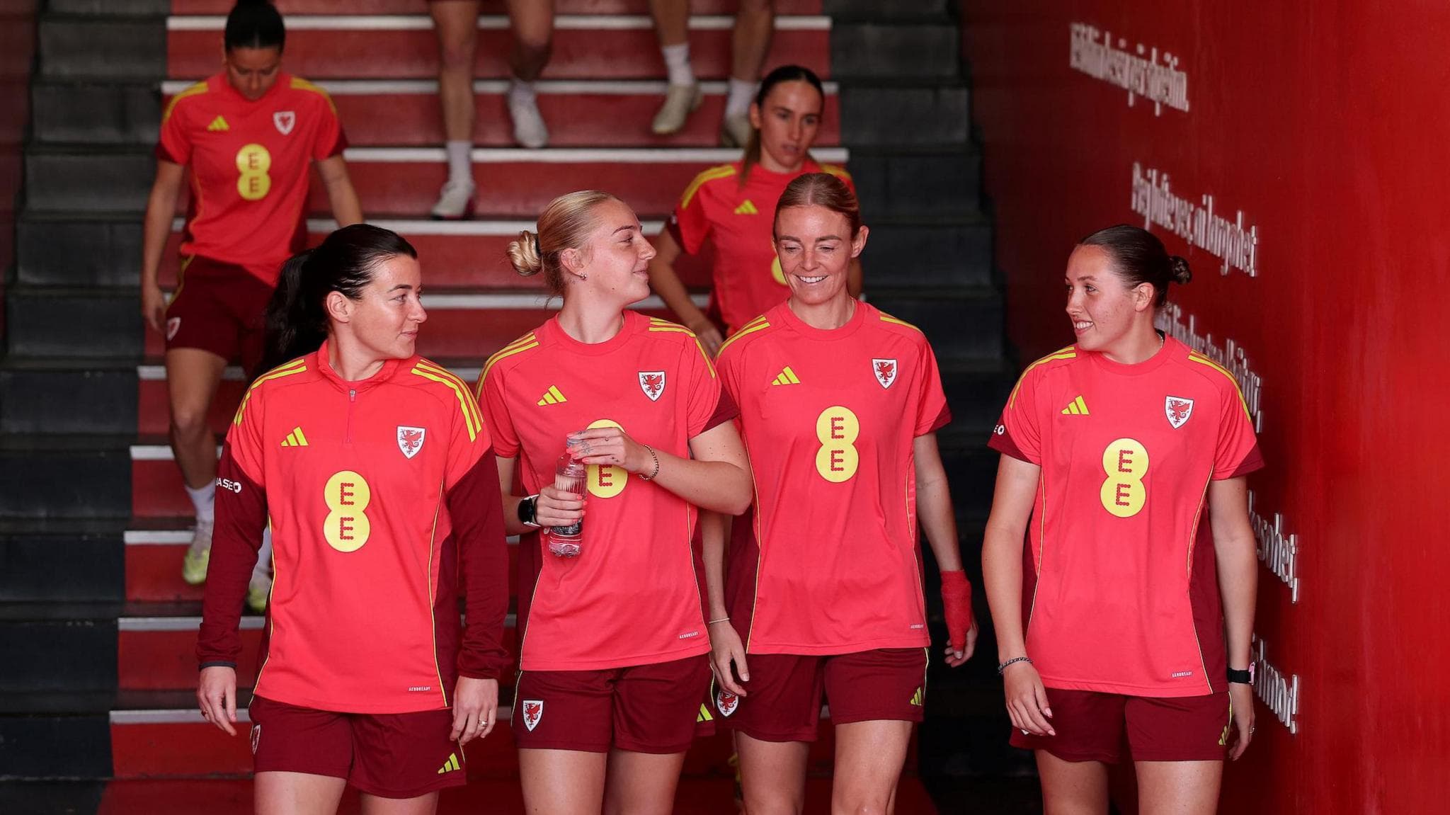 Angharad James, Mayzee Davies, Sophie Ingle and Mared Griffiths step out to train at the Elbasan Arena in Elbasan