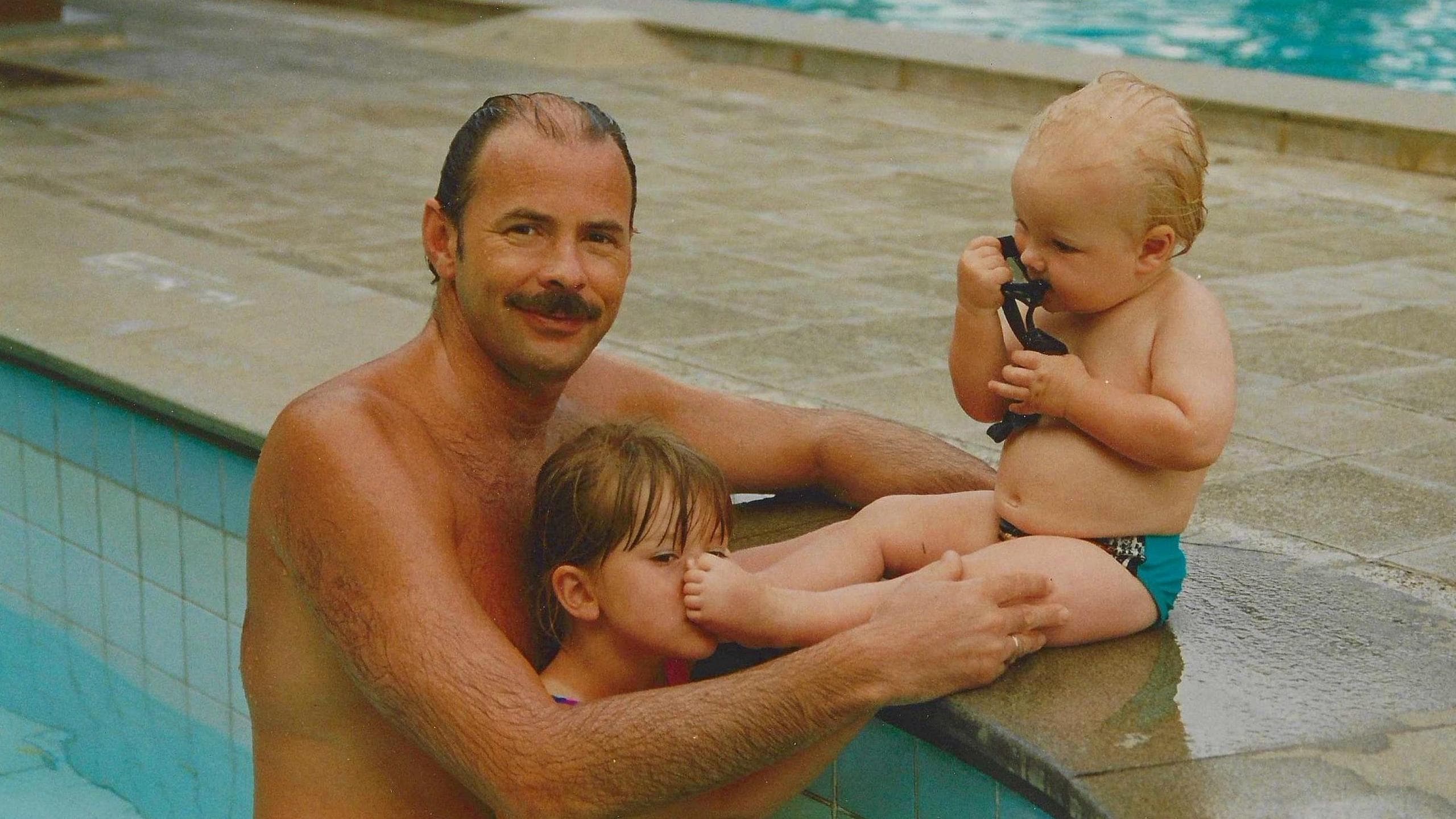 David Wilkie with children Adam and Natasha in swimming pool