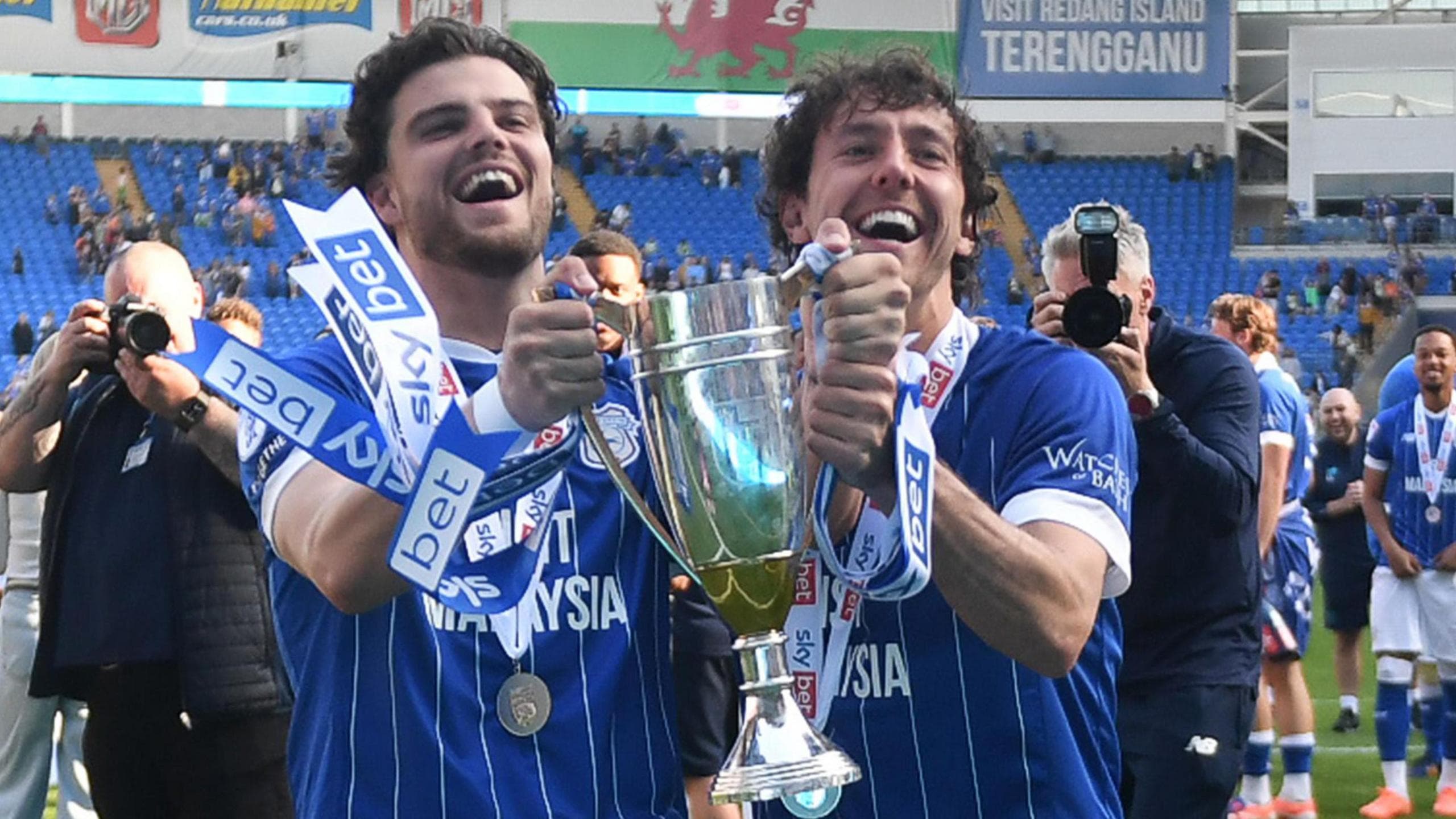 Ollie Tanner (left) celebrates League One promotion with Ryan Wintle