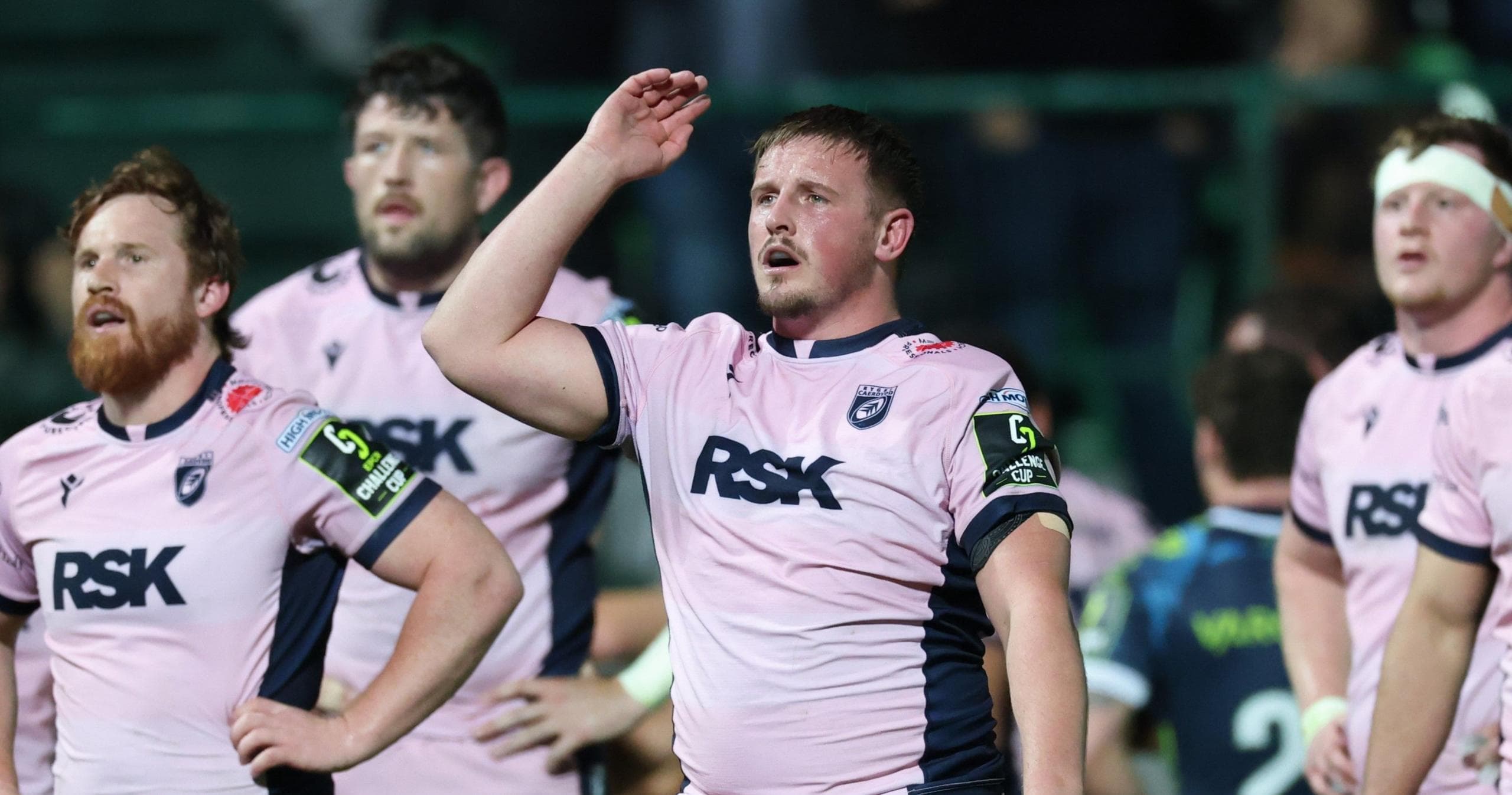 Daf Hughes and his Cardiff teammates look up at the big screen after defeat by Benetton