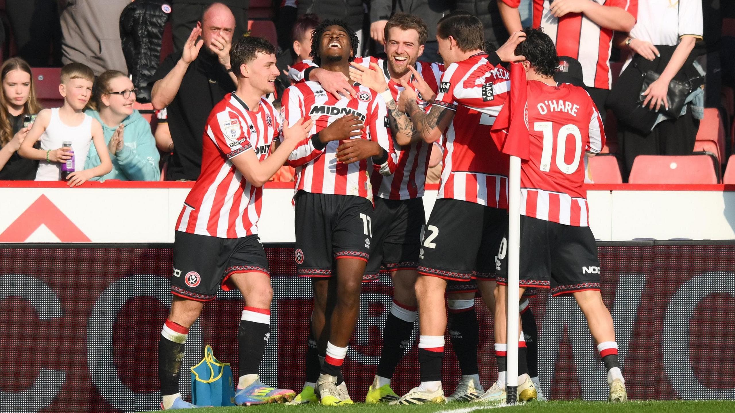 Sheffield United players celebrate with Andre Brooks