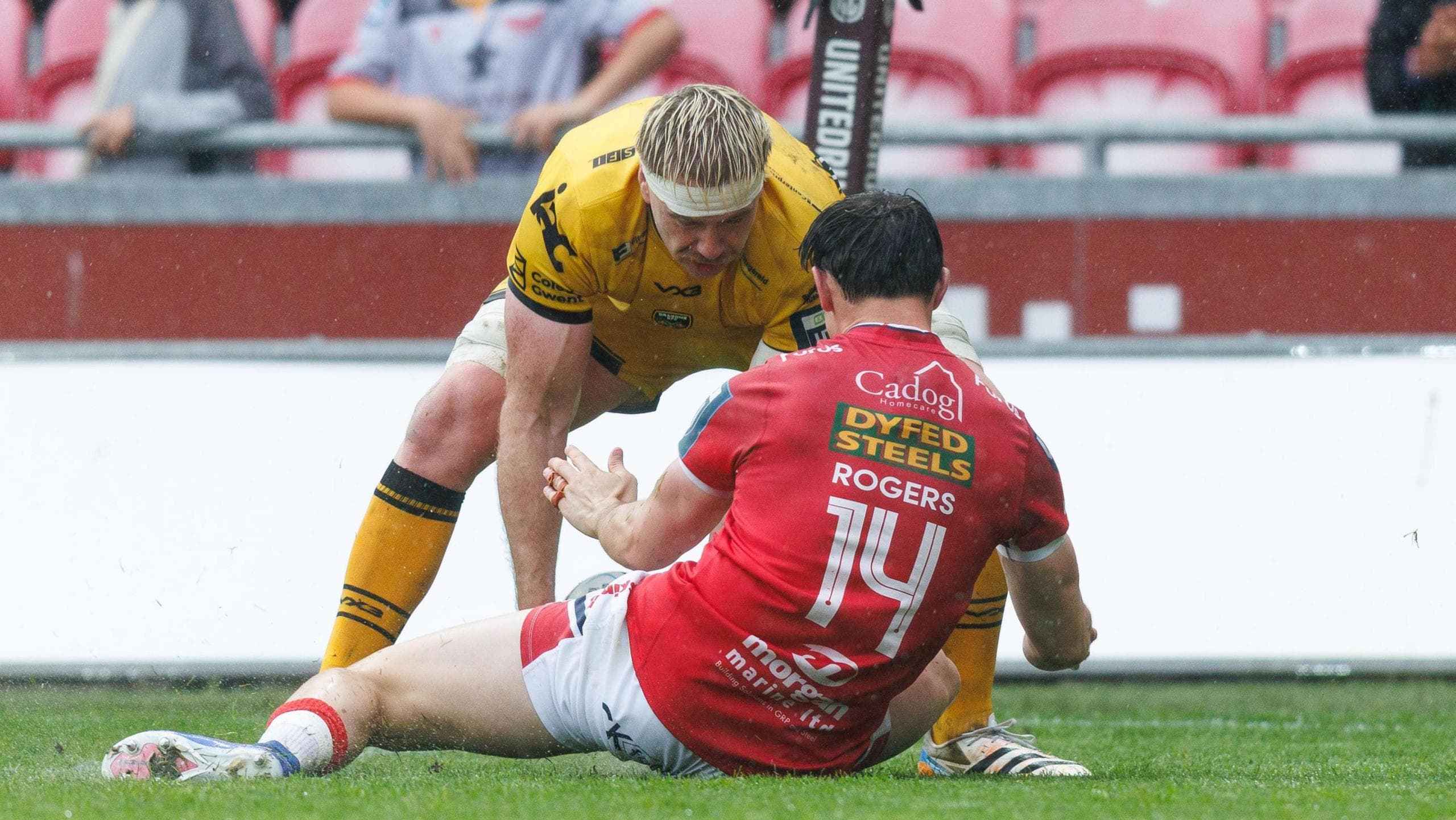Aaron Wainwright, who made his Dragons debut in 2017, scores a try despite pressure from Scarlets wing Tom Rogers