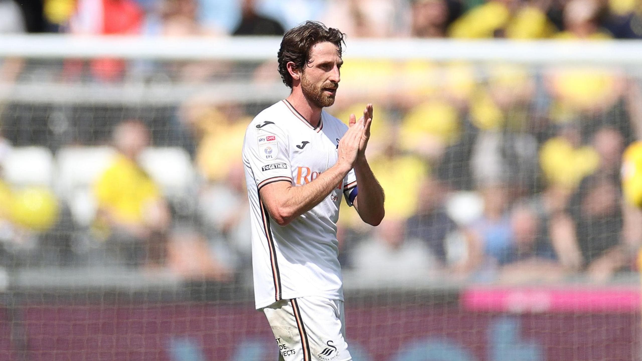 Joe Allen leaves the field in his final game for Swansea last May