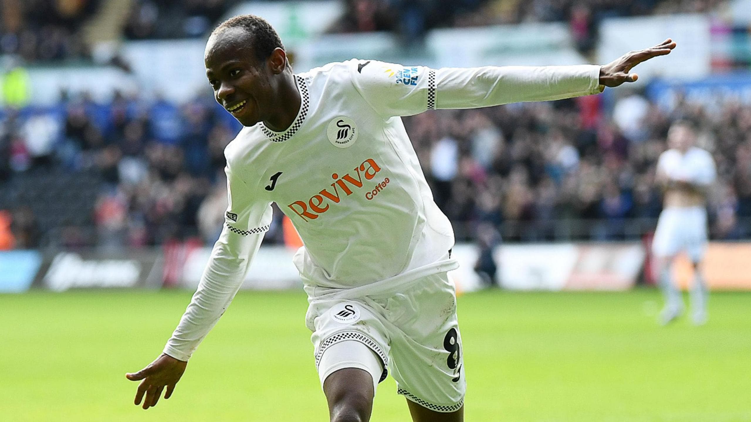 Malick Yalcouye celebrates a Swansea goal