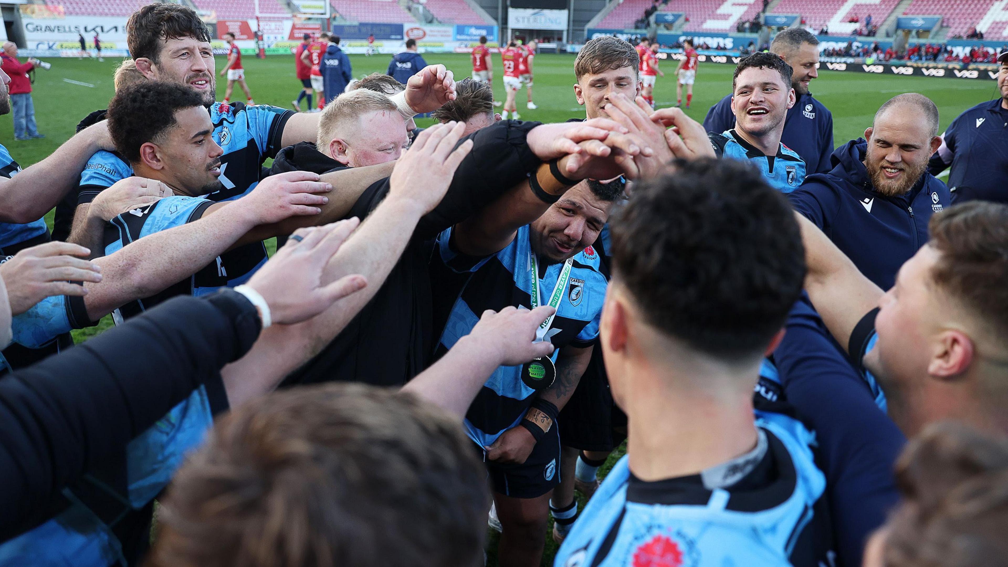 Cardiff players in a triumphant huddle after beating Scarlets in Aril 2026