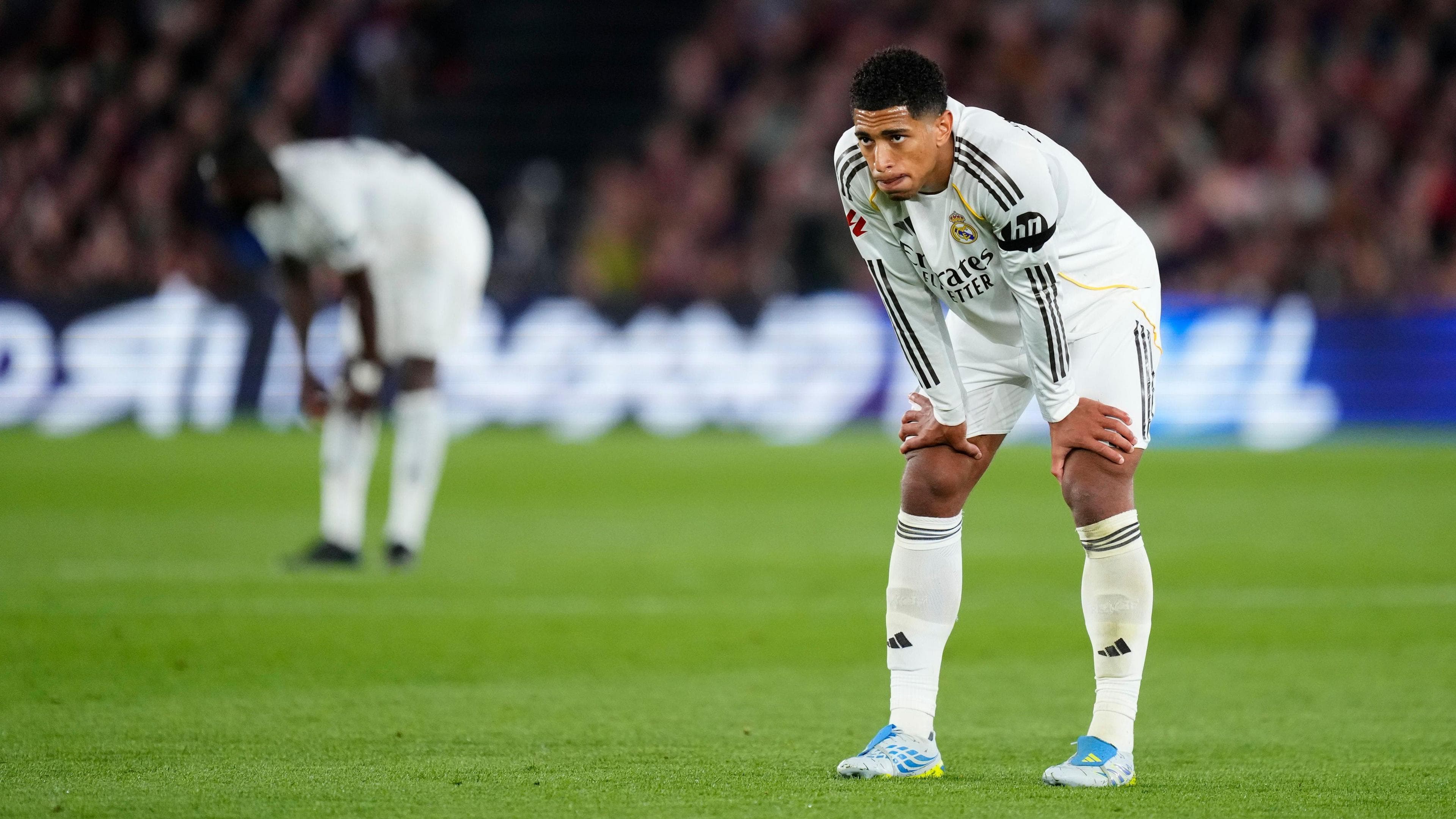 Jude Bellingham slumped over with his hands on his knees during the loss to Barcelona