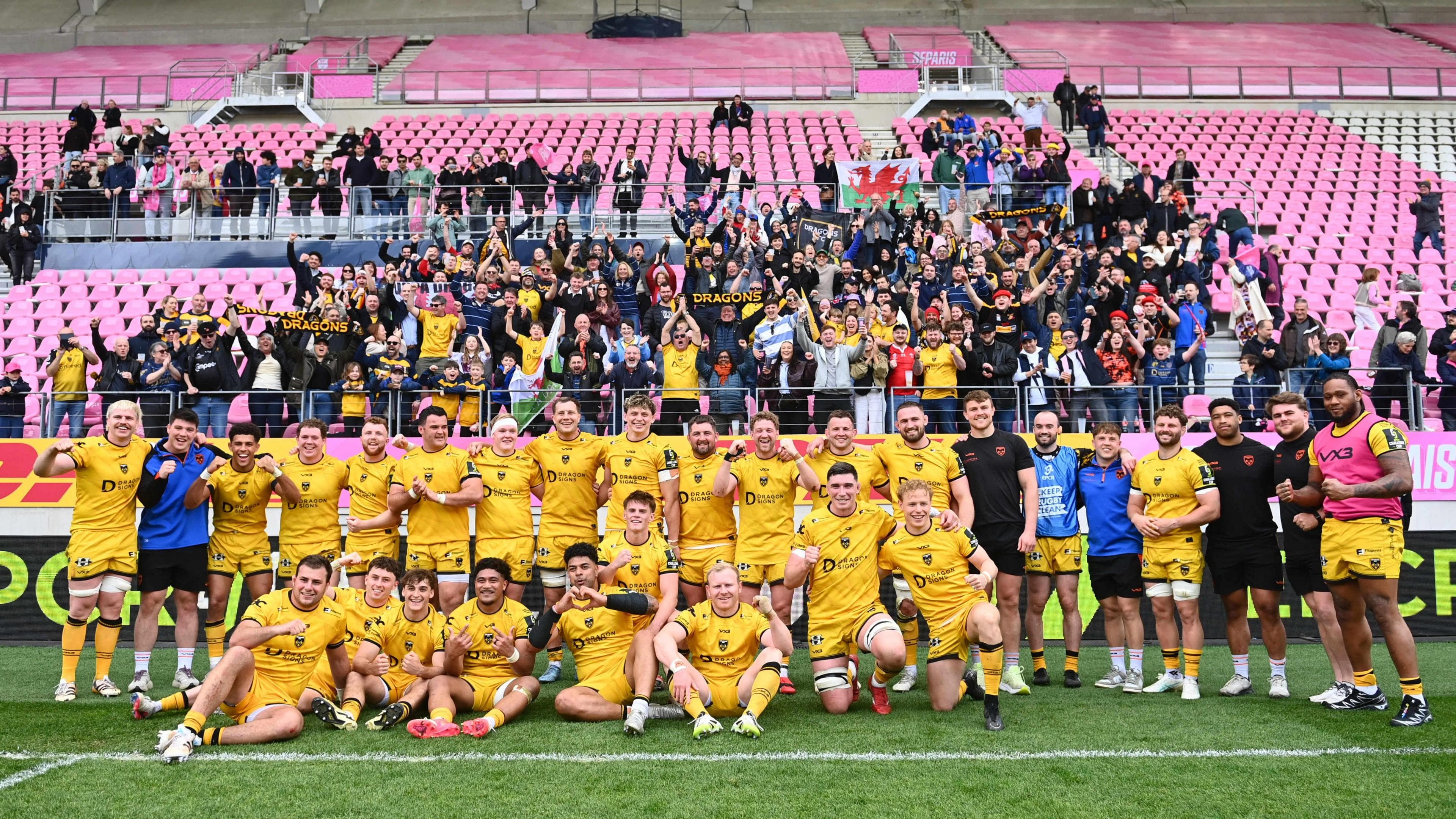 Dragons players and supporters celebrate after beating Stade Francais in Paris