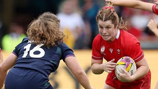 Wales captain Kate Williams charges at Scotland's Elis Martin