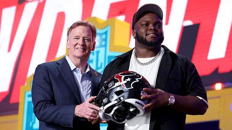 NFL commissioner Roger Goodell with Kayden McDonald after he was selected at the 2026 NFL Draft