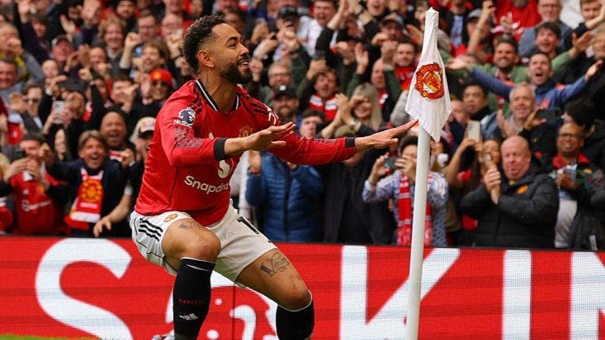 Manchester United forward Matheus Cunha does his surfing celebration after scoring at Old Trafford