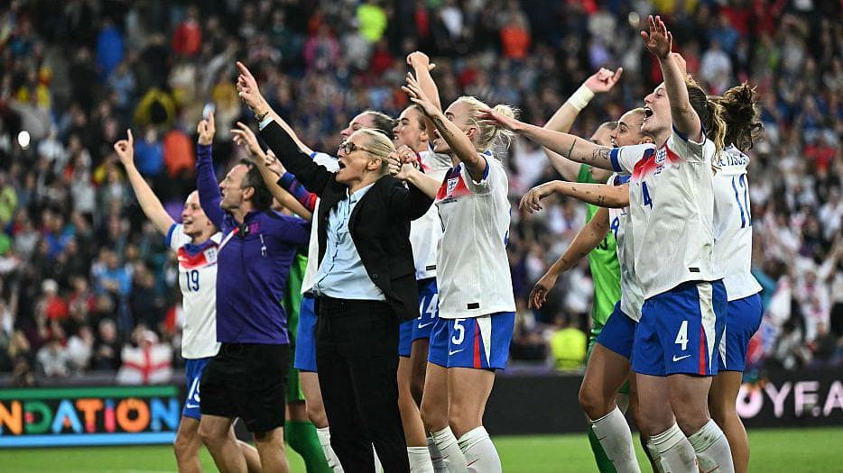 Sarina Wiegman and her players celebrate in front of the travelling fans after winning the Euro 2025 final against Spain