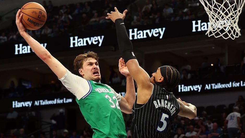 Cooper Flagg of the Dallas Mavericks goes for a dunk against Paolo Banchero