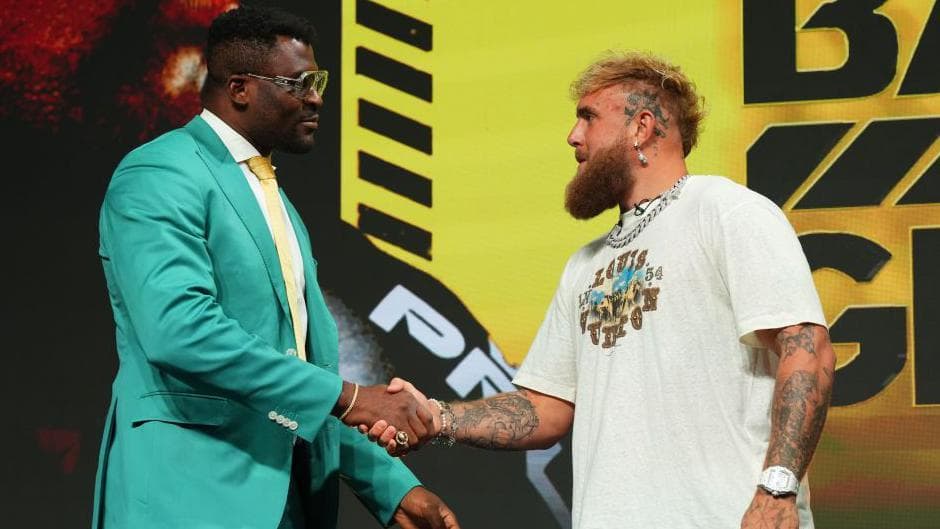 Francis Ngannou and Jake Paul shake hands