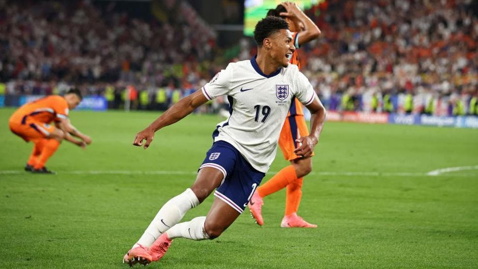 Ollie Watkins celebrates in an England shirt