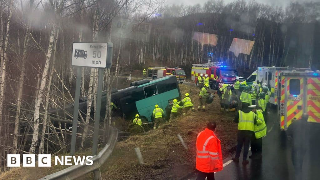 Two in hospital after bus crashes down embankment in the Highlands