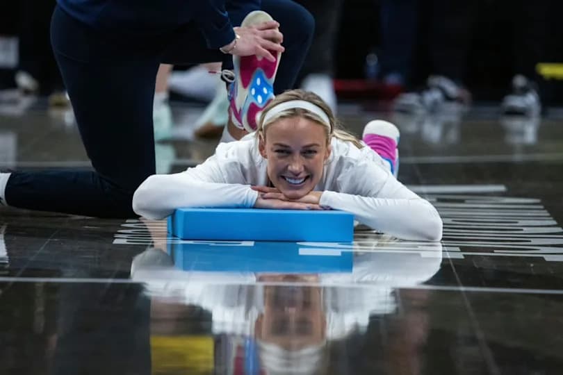 Indiana Fever guard Sophie Cunningham (8) stretches before the game against the Dallas Wings at the Gainbridge Fieldhouse.