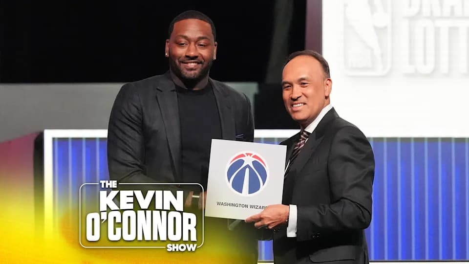 Washington Wizards' John Wall, left, and NBA Deputy Commissioner Mark Tatum, pose for photos after Tatum announced that the Wizards had won the first pick in the NBA basketball draft lottery in Chicago, Sunday, May 10, 2026. (AP Photo/Nam Y. Huh)