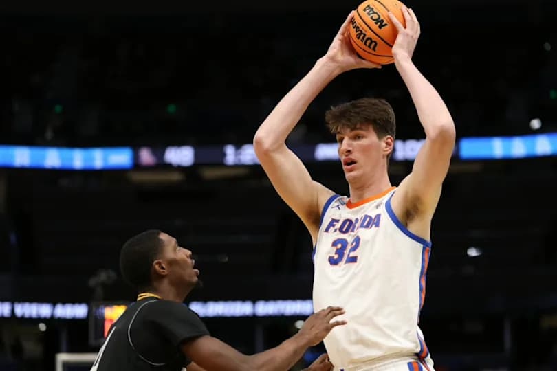 Florida Gators center Olivier Rioux (32) looks to pass in the second half against the Prairie View A&M Panthers during a first round game of the men's 2026 NCAA Tournament at Benchmark International Arena.