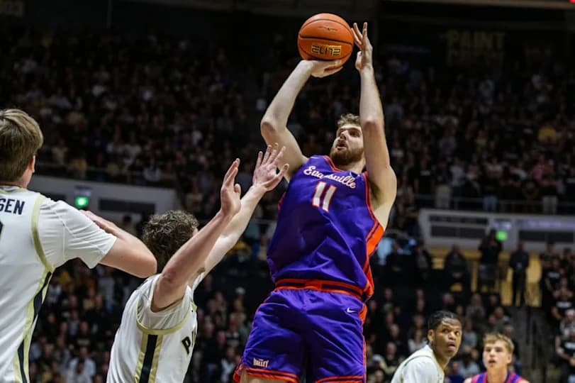 Evansville Purple Aces forward Joshua Hughes (11) shoots the ball while Purdue Boilermakers forward Trey Kaufman-Renn (4) defends in the first half at Mackey Arena.