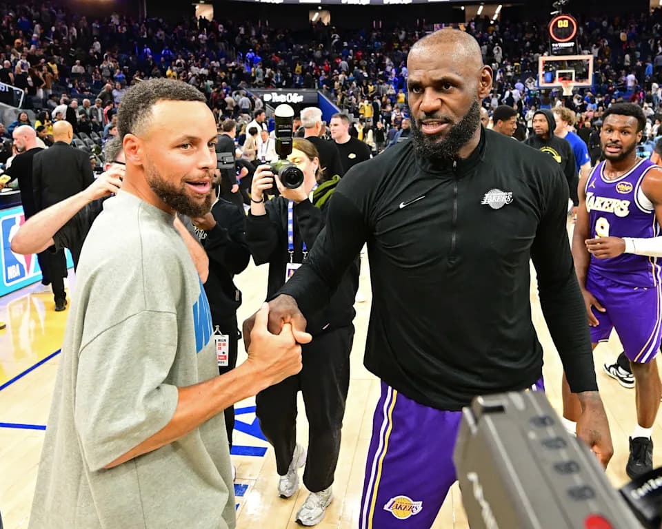 SAN FRANCISCO, CA - APRIL 9: LeBron James #23 of the Los Angeles Lakers and Stephen Curry #30 of the Golden State Warriors high five after the game on April 9, 2026 at Chase Center in San Francisco, California. NOTE TO USER: User expressly acknowledges and agrees that, by downloading and or using this photograph, user is consenting to the terms and conditions of Getty Images License Agreement. Mandatory Copyright Notice: Copyright 2026 NBAE (Photo by Adam Pantozzi/NBAE via Getty Images)