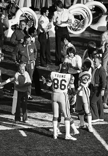 Los Angeles Rams tight end Charle Young (86) on the sideline with linebacker Joe Harris (51) and running back Eddie Hill (24) during Super Bowl XIV against the Pittsburgh Steelers at the Rose Bowl. The Steelers defeated the Rams 31-19.