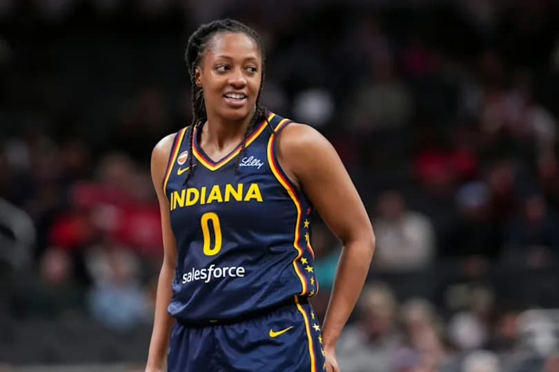 Indiana Fever guard Kelsey Mitchell (0) smiles during a free throw Saturday, May 2, 2026, during the first half of a preseason game at Gainbridge Fieldhouse in Indianapolis.