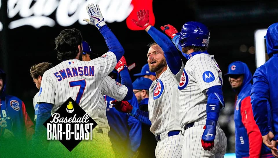 Chicago Cubs' Michael Busch, center, celebrates with Dansby Swanson (7) after hitting the game-winning one-run single during the 10th inning of a baseball game against the Cincinnati Reds in Chicago, Tuesday, May 5, 2026. (AP Photo/Nam Y. Huh)