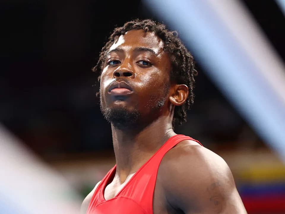 USA's Keyshawn Daniel Webster Davis reacts as he fights Cuba's Andy Cruz during their men's light (57-63kg) boxing final bout during the Tokyo 2020 Olympic Games at the Kokugikan Arena in Tokyo on August 8, 2021. (Photo by Buda Mendes / POOL / AFP) (Photo by BUDA MENDES/POOL/AFP via Getty Images)