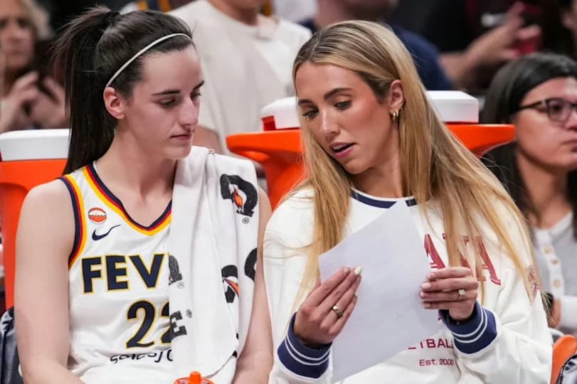 Indiana Fever guard Caitlin Clark (22) and Indiana Fever guard Lexie Hull (10) talk on the bench Thursday, April 30, 2026, during the first half of a preseason game between the Indiana Fever and the Dallas Wings at Gainbridge Fieldhouse in Indianapolis.