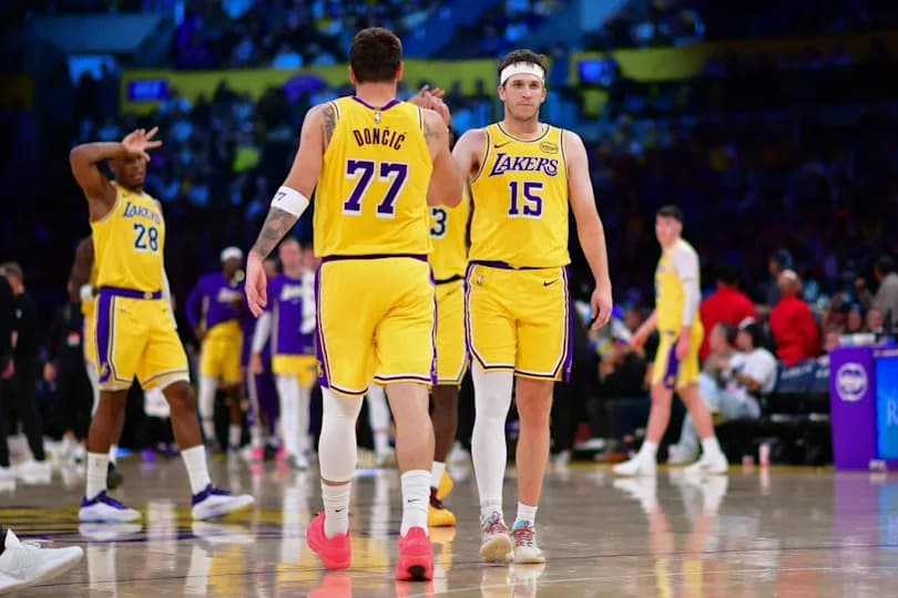 Los Angeles Lakers guard Luka Doncic (77) and guard Austin Reaves (15) react during the second half at Crypto.com Arena.