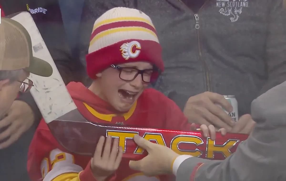 Young Flames fan brought to tears after Dustin Wolf gifts him a goalie stick